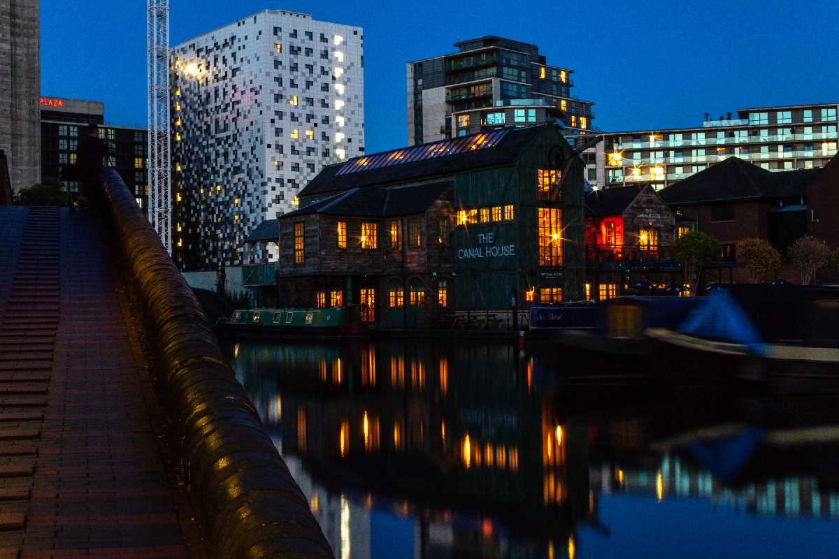 Colurful lights from the Canal House as darkness falls in Birmingham's Gas Street basin.
